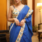 Bright blue Cotton saree with elephant print border and white lines
