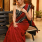 Breezy maroon plain Cotton saree with beautiful black Ikat border