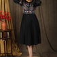 Trendy black cotton gathered dress with beautiful zari embroidery combined with chanderi sleeves