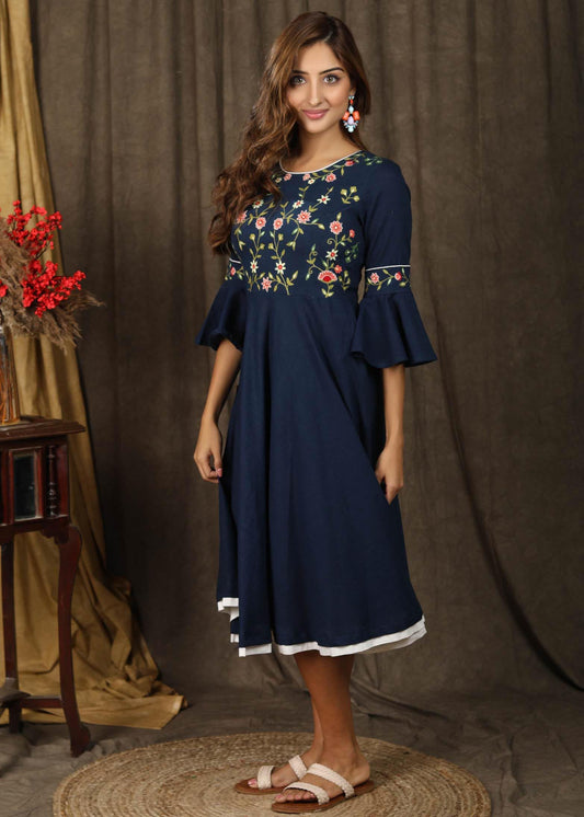 Classic navy blue gathered dress with bell sleeves and minimal floral embroidery