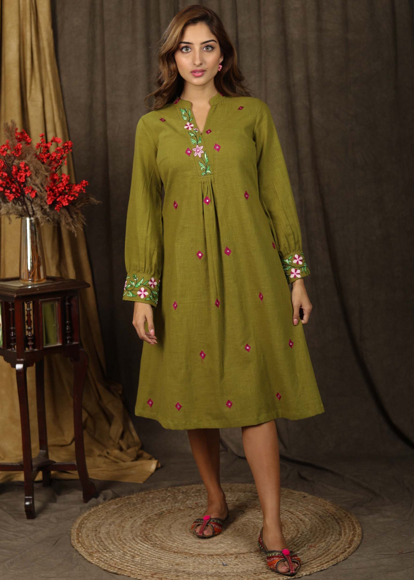 Exclusive henna green tunic dress with minimal floral embroidery on sleeves and neckline
