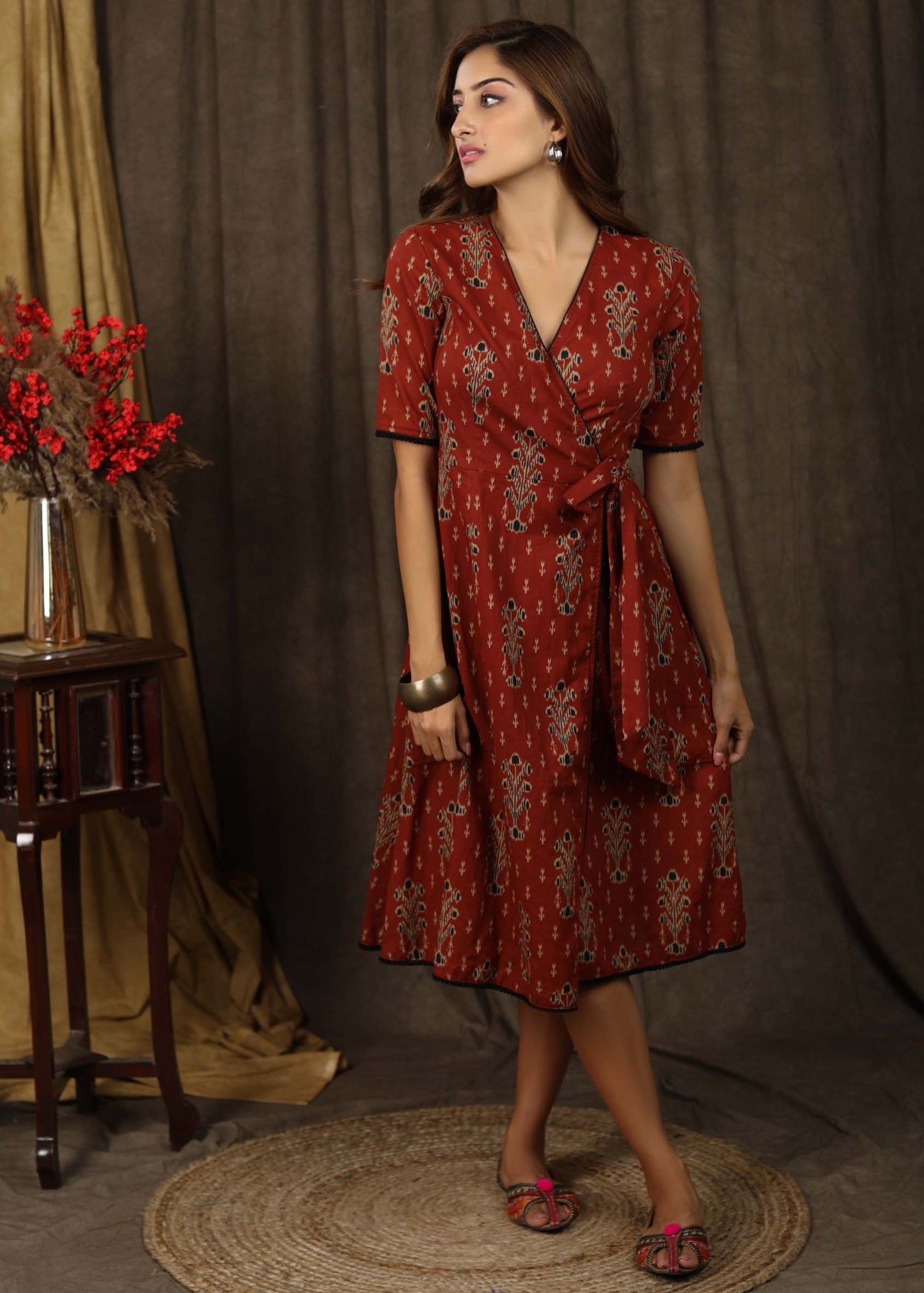 Trendy brick brown aztec print overlap dress highlighted with subtle pompom lace