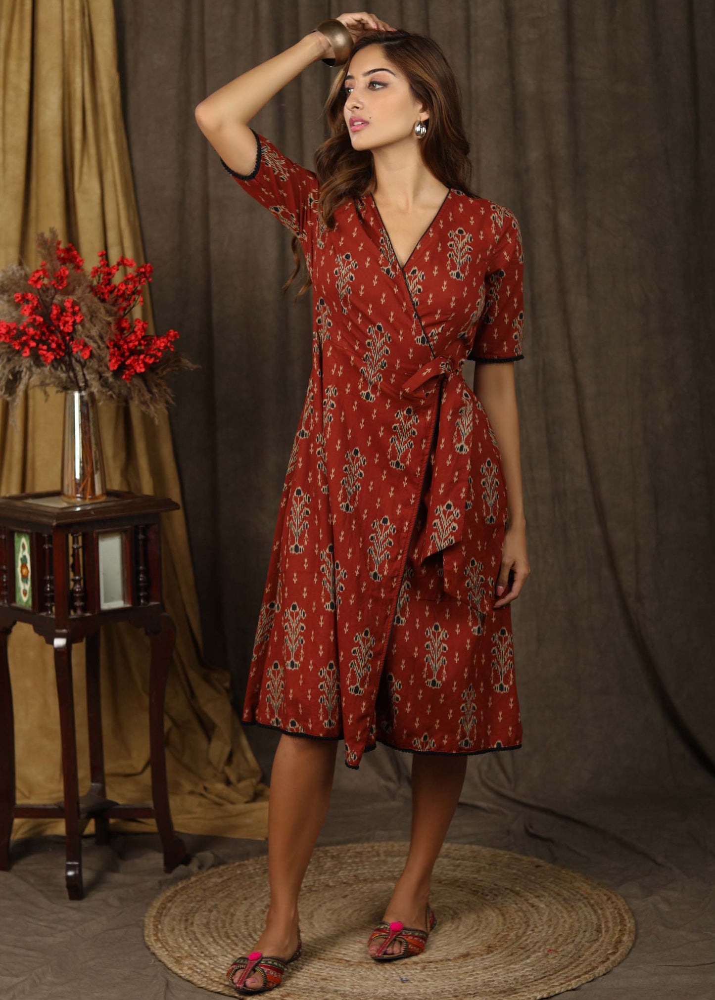 Trendy brick brown aztec print overlap dress highlighted with subtle pompom lace