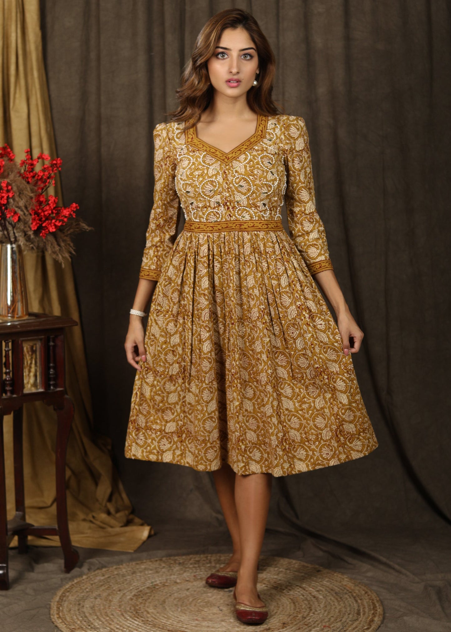 Casual mustard floral printed gathered dress with highlighted with beautiful pearl hand embroidery