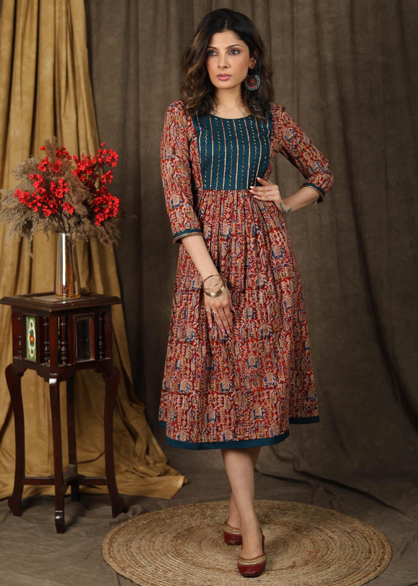 Elegant kalamkari dress with beautiful teal embroidered yoke