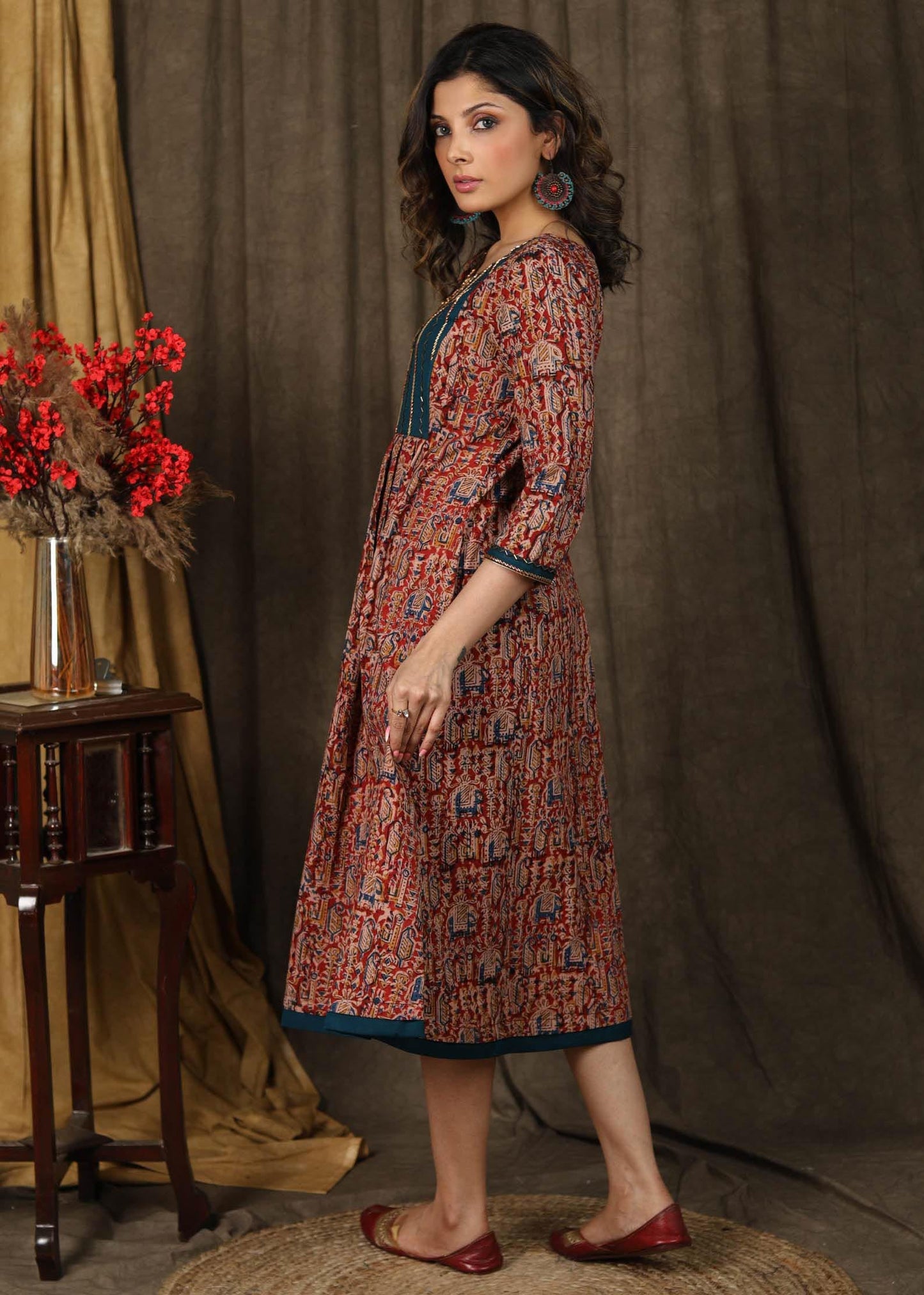 Elegant kalamkari dress with beautiful teal embroidered yoke