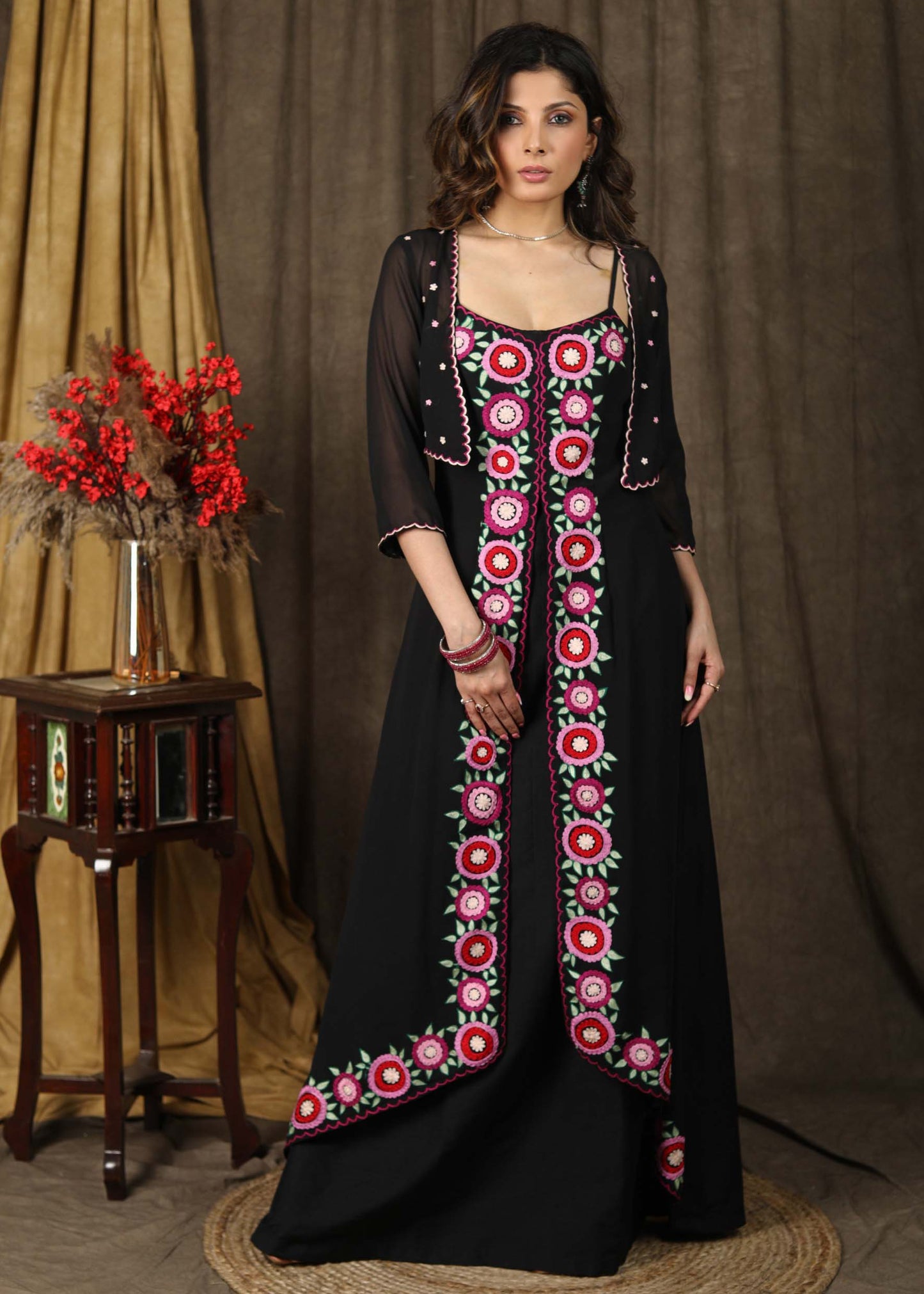 Classy black boho inspired strappy maxi dress with floral embroidery on front layer with optional georgette shrug