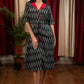 Black ikat dress with red silk collar