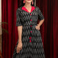 Black ikat dress with red silk collar
