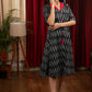 Black ikat dress with red silk collar