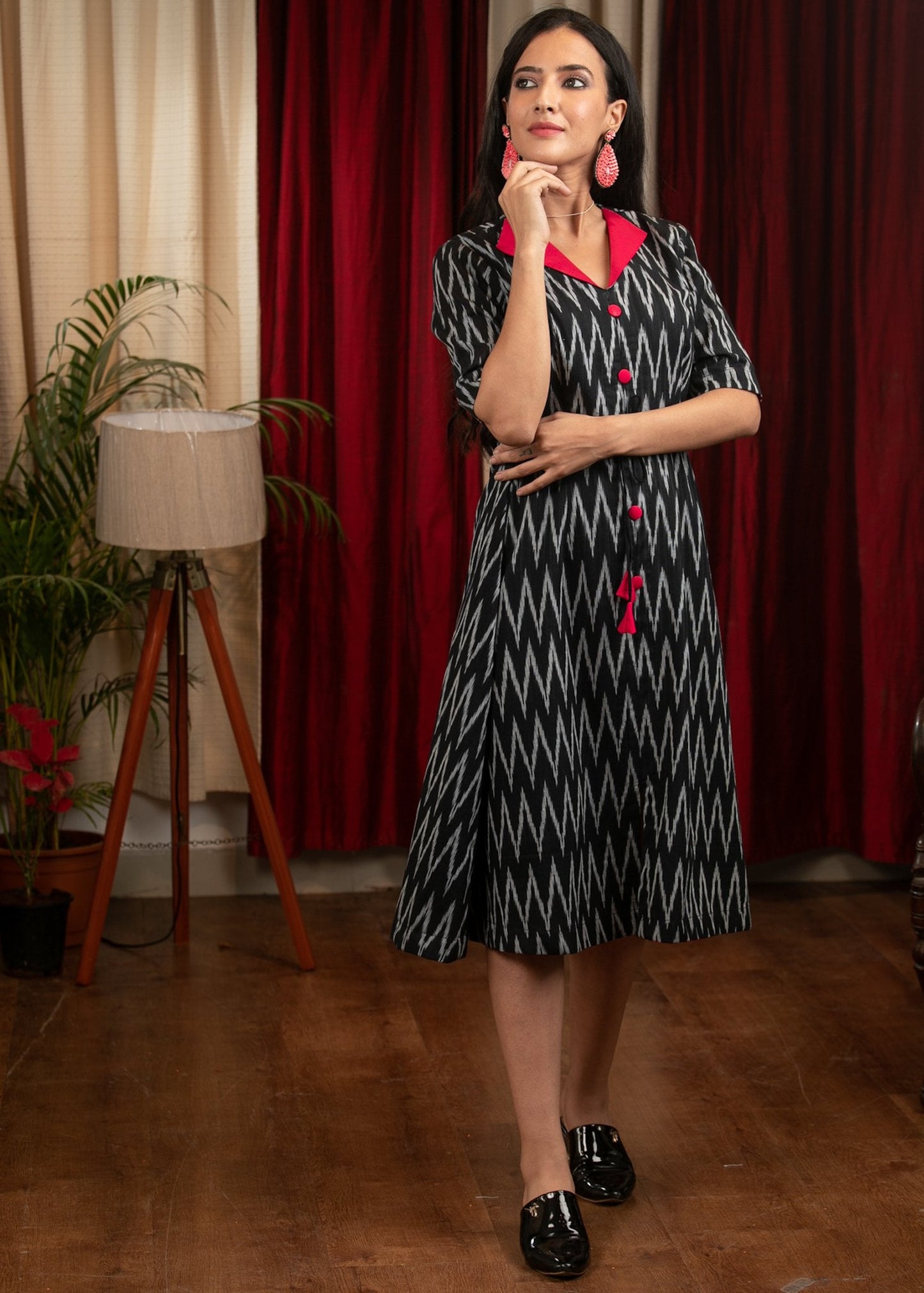 Black ikat dress with red silk collar