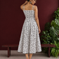 White Cotton Fit & Flare Midi Dress with Black Feather Print and Double Strap Detail — back view