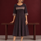 Elegant Black Ajrakh Polka Dot Printed Dress with Maroon Ajrakh Floral Border Yoke and Matching Sleeve Cuffs — front view