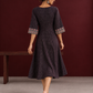 Elegant Black Ajrakh Polka Dot Printed Dress with Maroon Ajrakh Floral Border Yoke and Matching Sleeve Cuffs — back view