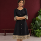 Elegant Black Cotton A-Line Dress with Madhubani Print Border Hem and Matching Bell Sleeve Cuffs — styled view