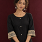 Elegant Black Cotton A-Line Dress with Madhubani Print Border Hem and Matching Bell Sleeve Cuffs — fabric detail