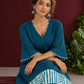 Teal Blue Cotton Dress with Abstract Print Hem Panel and Sleeve Cuffs — seated detail