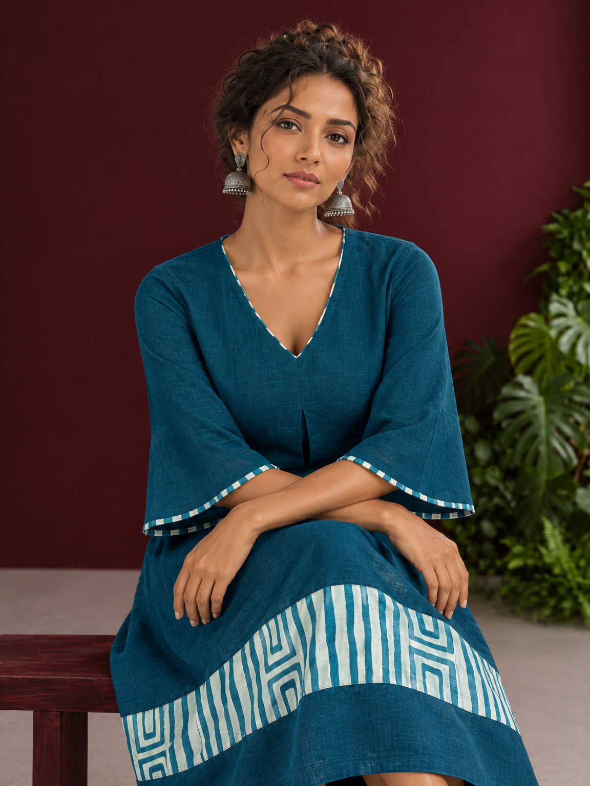 Teal Blue Cotton Dress with Abstract Print Hem Panel and Sleeve Cuffs — seated detail