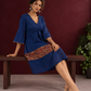 Timeless Navy Blue Cotton Dress with Kalamkari Print Hem Border & Contrast Neckline and Cuff Trim — seated