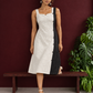 Elegant Off-White Cotton A-Line Dress with Contrast Black Pinstripe Side Panel & Button Detailing — side view