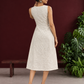 Elegant Off-White Cotton A-Line Dress with Contrast Black Pinstripe Side Panel & Button Detailing — back view