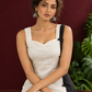 Elegant Off-White Cotton A-Line Dress with Contrast Black Pinstripe Side Panel & Button Detailing — seated detail