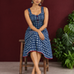 Indigo Blue Cotton One Piece Dress with Contrast Maroon Piping & Button Detail — seated