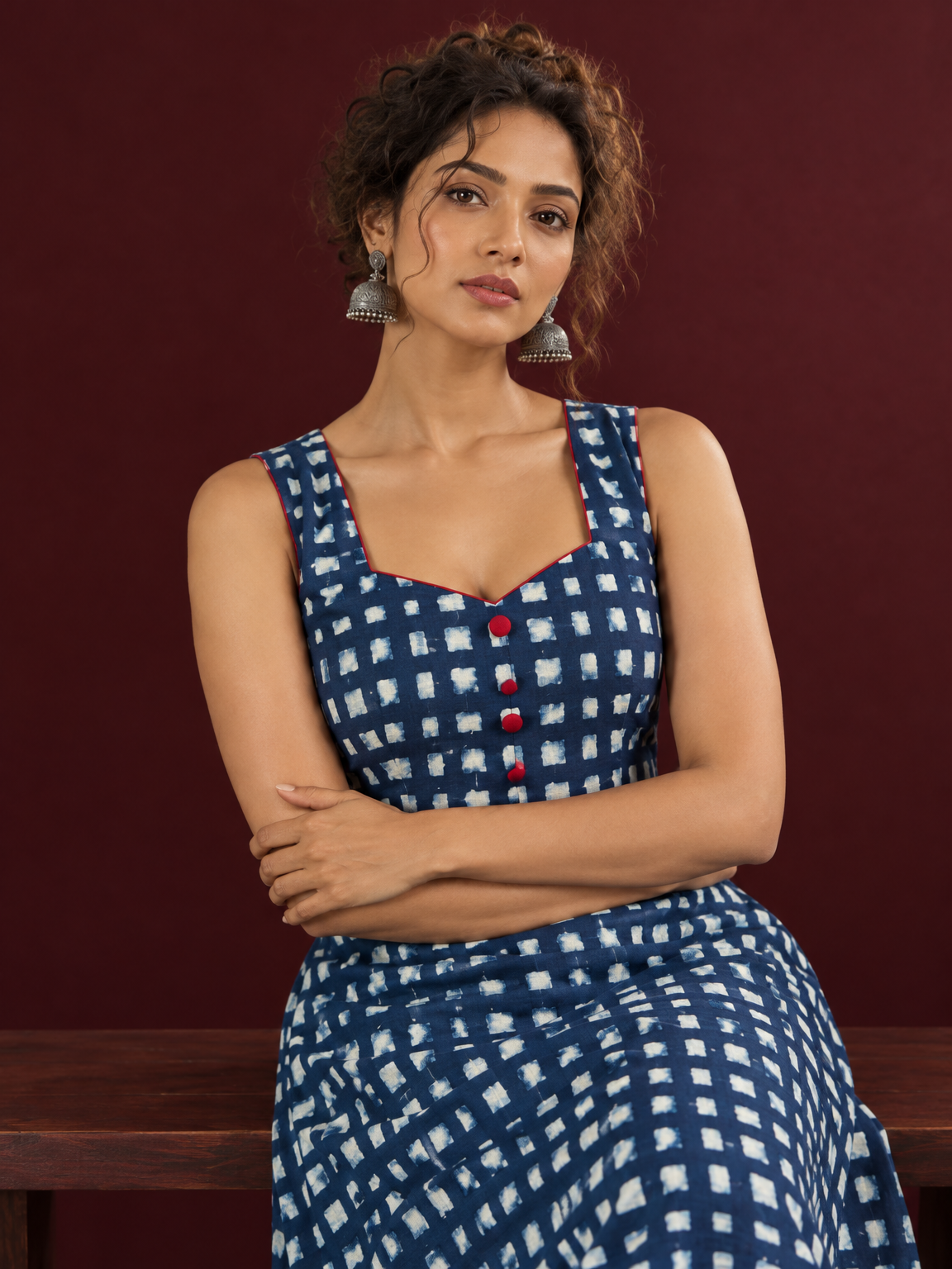 Indigo Blue Cotton One Piece Dress with Contrast Maroon Piping & Button Detail — seated detail
