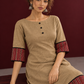 Timeless Beige Cotton A-Line Dress with Maroon Zigzag Print Sleeve Cuffs & Hem Border — seated detail
