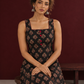 Classic Black Ajrakh Cotton Sleeveless Dress with Floral Print and Maroon Piping Square Neckline — seated detail