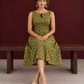 Olive Green Cotton A-Line Dress with Mustard Yellow Ajrakh Print and Keyhole Neckline — seated