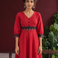 Vibrant Red Cotton Fit & Flare Dress with Contrast Black Ikat Waistband & Matching Cuffs — styled view