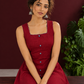Maroon Cotton Sleeveless Dress with Contrast Chevron Print Indigo Hem Panel and Square Neckline — seated detail