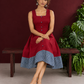 Maroon Cotton Sleeveless Dress with Contrast Chevron Print Indigo Hem Panel and Square Neckline — seated