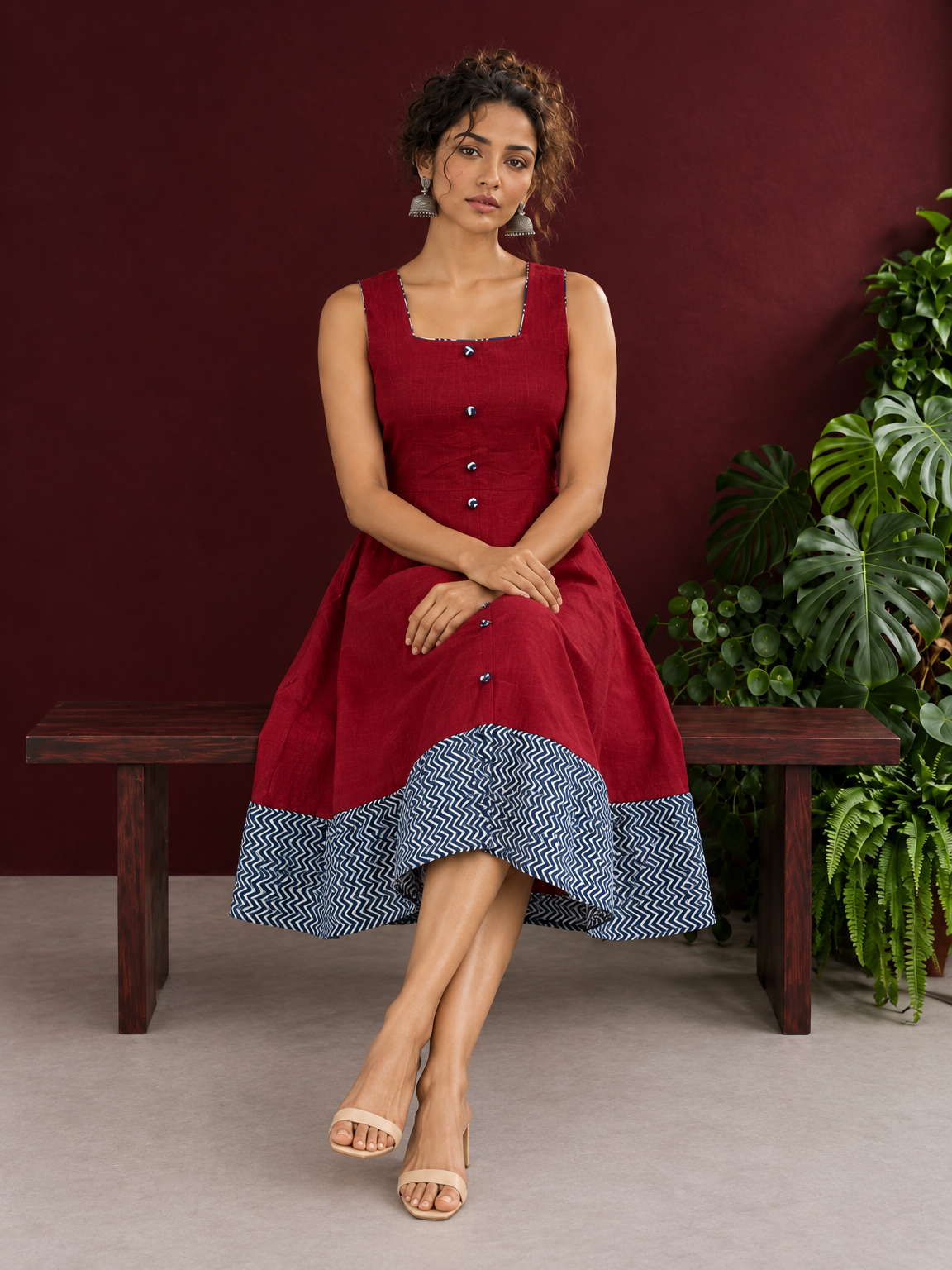 Maroon Cotton Sleeveless Dress with Contrast Chevron Print Indigo Hem Panel and Square Neckline — seated