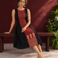 Timeless Black Cotton A-Line Dress with Maroon Ajrakh Print Center Panel & Contrast Piping — seated