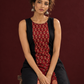 Timeless Black Cotton A-Line Dress with Maroon Ajrakh Print Center Panel & Contrast Piping — seated detail