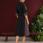 Timeless Black Cotton Shirt Dress with Contrast Striped Panel & Coordinated Sleeve Cuffs — back view