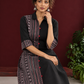 Timeless Black Cotton Shirt Dress with Contrast Striped Panel & Coordinated Sleeve Cuffs — seated detail