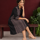 Timeless Black Cotton Shirt Dress with Contrast Striped Panel & Coordinated Sleeve Cuffs — seated