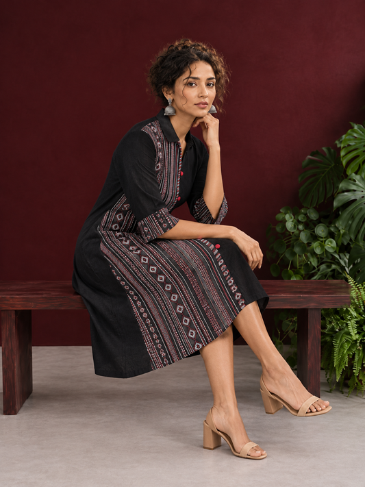 Timeless Black Cotton Shirt Dress with Contrast Striped Panel & Coordinated Sleeve Cuffs — seated