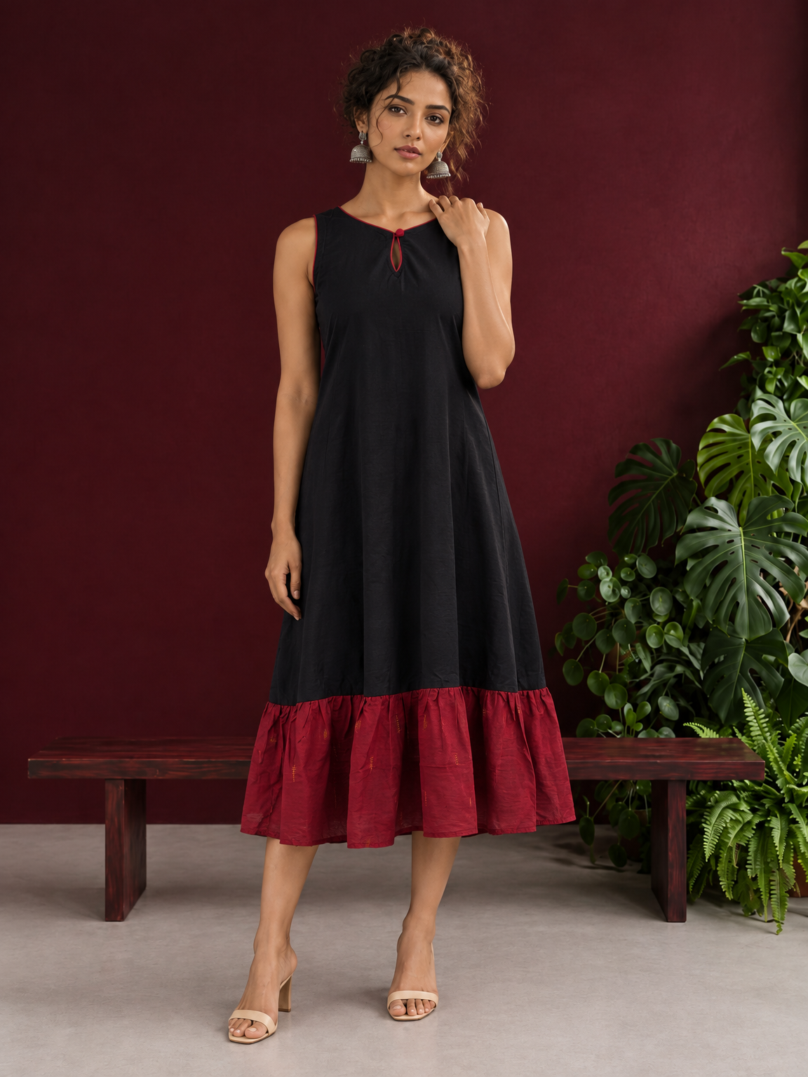 Classic Black Cotton Silk Dress with Keyhole Neckline and Contrast Maroon Ruffle Hem — front view