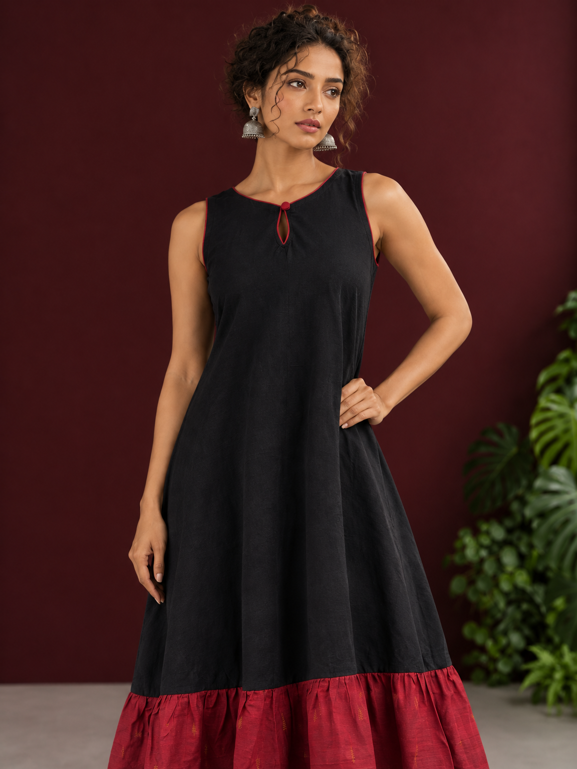 Classic Black Cotton Silk Dress with Keyhole Neckline and Contrast Maroon Ruffle Hem — fabric detail