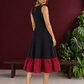Classic Black Cotton Silk Dress with Keyhole Neckline and Contrast Maroon Ruffle Hem — back view