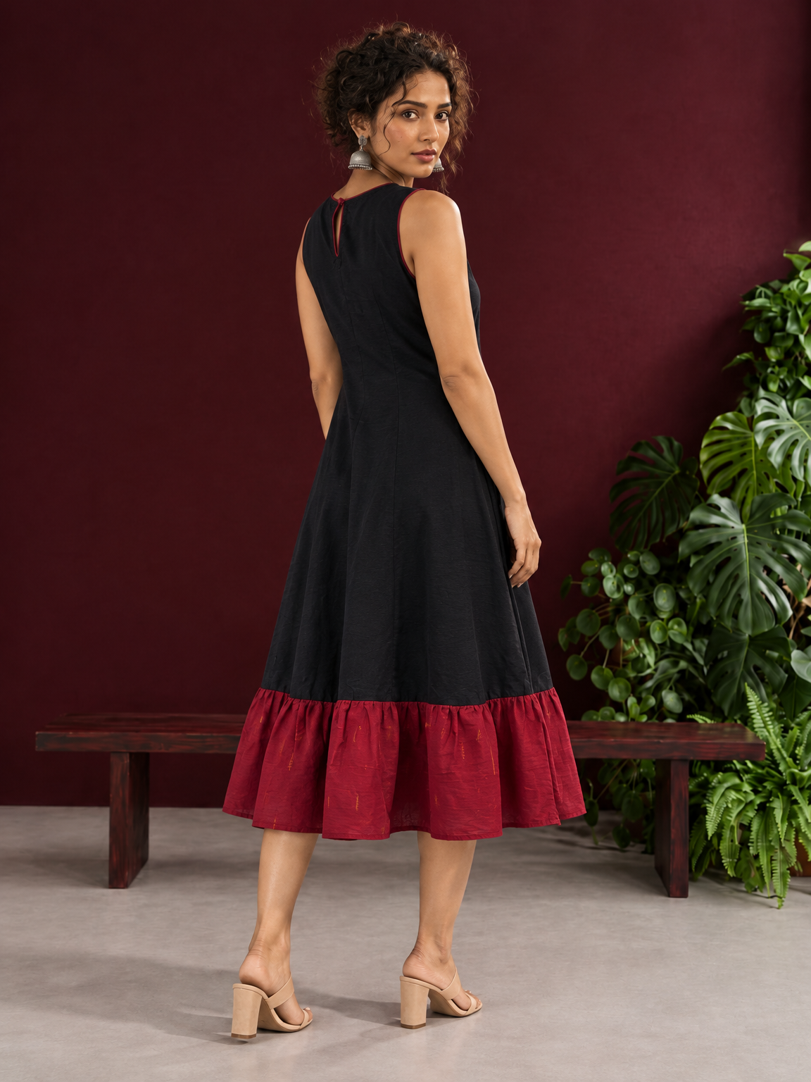 Classic Black Cotton Silk Dress with Keyhole Neckline and Contrast Maroon Ruffle Hem — back view