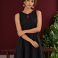 Classic Black Cotton Silk Dress with Keyhole Neckline and Contrast Maroon Ruffle Hem — styled view