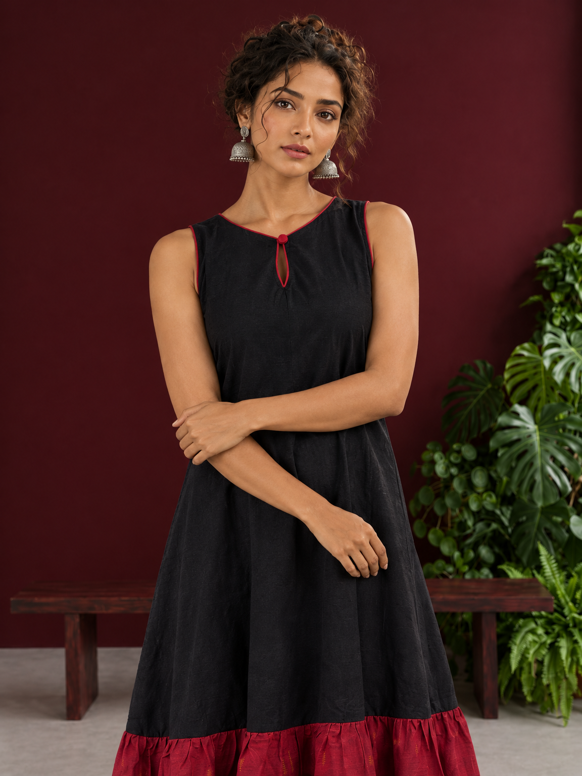Classic Black Cotton Silk Dress with Keyhole Neckline and Contrast Maroon Ruffle Hem — styled view