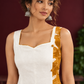 Elegant Off-White Cotton One Piece Dress with Mustard Floral Print Side Panel & Button Detailing — fabric detail