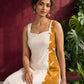 Elegant Off-White Cotton One Piece Dress with Mustard Floral Print Side Panel & Button Detailing — seated detail