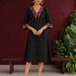Classic Black Cotton A-line Dress with Contrast Maroon Ikat Collar and Matching Sleeve Cuffs — front view